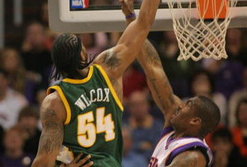 PHOENIX - FEBRUARY 8:  Chris Wilcox #54 of the Seattle SuperSonics tips the ball in over Amare' Stoudemire #1 of the Phoenix Suns on February 8, 2008 at US Airways Center in Phoenix, Arizona. NOTE TO USER: User expressly acknowledges and agrees that, by downloading and or using this Photograph, user is consenting to the terms and conditions of the Getty Images License Agreement.(Photo by Domenic Centofanti/Getty Images)
