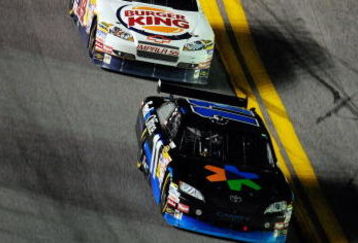 DAYTONA BEACH, FL - JULY 04:  Denny Hamlin, driver of the #11 FedEx Office Toyota, leads Tony Stewart, driver of the #14 Burger King Chevrolet,  Kyle Busch, driver of the #18 Interstate Batteries Toyota, during the NASCAR Sprint Cup Series 51st Annual Coke Zero 400 at Daytona International Speedway on July 4, 2009 in Daytona Beach, Florida.  (Photo by Sam Greenwood/Getty Images)