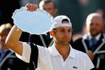 WIMBLEDON, ENGLAND - JULY 05:  Andy Roddick of USA looks despondent after defeat during the men's singles final match against Roger Federer of Switzerland on Day Thirteen of the Wimbledon Lawn Tennis Championships at the All England Lawn Tennis and Croquet Club on July 5, 2009 in London, England. Federer won 5-7, 7-6, 7-6, 3-6, 16-14.  (Photo by Paul Gilham/Getty Images)