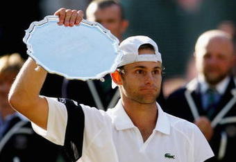 WIMBLEDON, ENGLAND - JULY 05:  Andy Roddick of USA looks despondent after defeat during the men's singles final match against Roger Federer of Switzerland on Day Thirteen of the Wimbledon Lawn Tennis Championships at the All England Lawn Tennis and Croquet Club on July 5, 2009 in London, England. Federer won 5-7, 7-6, 7-6, 3-6, 16-14.  (Photo by Paul Gilham/Getty Images)