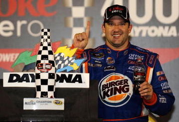 DAYTONA BEACH, FL - JULY 04: Tony Stewart, driver of the #14 Burger King Chevrolet, celebrates in victory lane after winning the NASCAR Sprint Cup Series 51st Annual Coke Zero 400 at Daytona International Speedway on July 4, 2009 in Daytona Beach, Florida.  (Photo by Rusty Jarrett/Getty Images for NASCAR)