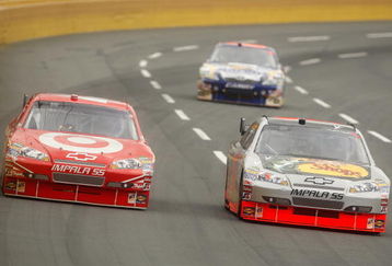 CONCORD, NC - MAY 25:  Juan Pablo Montoya, driver of the #42 Target Chevrolet, races Martin Truex Jr., driver of the #1 Bass Pro Shops/Tracker Boats Chevrolet, during the NASCAR Sprint Cup Series Coca-Cola 600 on May 25, 2009 at Lowe's Motor Speedway in Concord, North Carolina.  (Photo by Streeter Lecka/Getty Images)
