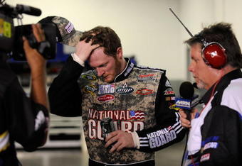 DAYTONA BEACH, FL - JULY 04: Dale Earnhardt Jr, driver of the #88 National Guard/AMP Energy Chevrolet, speaks to the media in the garage after wrecking his car during the NASCAR Sprint Cup Series 51st Annual Coke Zero 400 at Daytona International Speedway on July 4, 2009 in Daytona Beach, Florida.  (Photo by Rusty Jarrett/Getty Images for NASCAR)