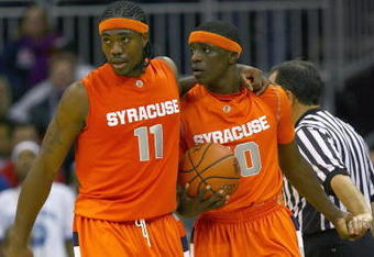 KANSAS CITY, MO - NOVEMBER 24:  Paul Harris #11 and Jonny Flynn #10 of the Syracuse Orange walks on court against the Florida Gators during the CBE Classic game on November 24, 2008 at the Sprint Center in Kansas City, Missouri. (Photo by Jamie Squire/Getty Images)
