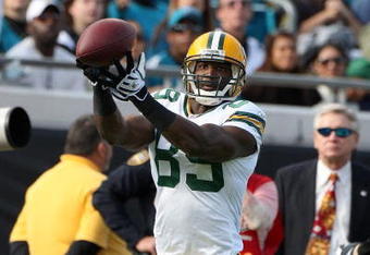 JACKSONVILLE, FL - DECEMBER 14:  Greg Jennings #85 makes a reception during the game against the Jacksonville Jaguars at Jacksonville Municipal stadium on December 14, 2008 in Jacksonville, Florida.  (Photo by Sam Greenwood/Getty Images)