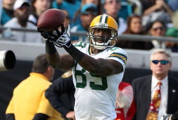 JACKSONVILLE, FL - DECEMBER 14:  Greg Jennings #85 makes a reception during the game against the Jacksonville Jaguars at Jacksonville Municipal stadium on December 14, 2008 in Jacksonville, Florida.  (Photo by Sam Greenwood/Getty Images)