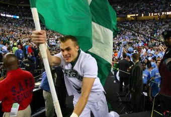 DETROIT - APRIL 06:  A Michigan State Spartans cheerleader runs out with the flag against the North Carolina Tar Heels during the 2009 NCAA Division I Men's Basketball National Championship game at Ford Field on April 6, 2009 in Detroit, Michigan.  (Photo by Streeter Lecka/Getty Images)