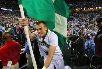 DETROIT - APRIL 06:  A Michigan State Spartans cheerleader runs out with the flag against the North Carolina Tar Heels during the 2009 NCAA Division I Men's Basketball National Championship game at Ford Field on April 6, 2009 in Detroit, Michigan.  (Photo by Streeter Lecka/Getty Images)