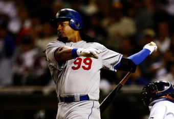 SAN DIEGO - JULY 3:  Manny Ramirez #99 of the Los Angeles Dodgers flies out in the sixth inning against the San Diego Padres during the game on July 3, 2009 at Petco Park in San Diego, California. Ramirez was taken out of the game in the sixth inning and ended the game 0-3. (Photo by Jeff Gross/Getty Images)