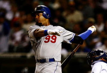 SAN DIEGO - JULY 3:  Manny Ramirez #99 of the Los Angeles Dodgers flies out in the sixth inning against the San Diego Padres during the game on July 3, 2009 at Petco Park in San Diego, California. Ramirez was taken out of the game in the sixth inning and ended the game 0-3. (Photo by Jeff Gross/Getty Images)