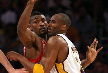 LOS ANGELES, CA - MAY 17:  Kobe Bryant #24 of the Los Angeles Lakers is covered by Ron Artest #96 of the Houston Rockets in the third quarter of Game Seven of the Western Conference Semifinals during the 2009 NBA Playoffs at Staples Center on May 17, 2009 in Los Angeles, California. NOTE TO USER: User expressly acknowledges and agrees that, by downloading and or using this photograph, User is consenting to the terms and conditions of the Getty Images License Agreement.  (Photo by Stephen Dunn/Getty Images)