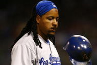 SAN DIEGO - JULY 3:  Manny Ramirez #99 of the Los Angeles Dodgers tosses his helmet against the San Diego Padres during the game on July 3, 2009 at Petco Park in San Diego, California. (Photo by Jeff Gross/Getty Images)