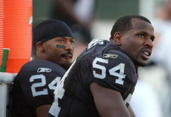OAKLAND, CA - NOVEMBER 2:  Michael Huff #24 and Sam Williams #54 of the Oakland Raiders look on from the bench area during the game against the the Atlanta Falcons on November 2, 2008 at the Oakland-Alameda County Coliseum in Oakland, California. The Falcons defeated the Raiders 24-0. (Photo by Jed Jacobsohn/Getty Images)