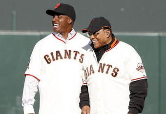 SAN FRANCISCO - AUGUST 9: Barry Bonds shares a laugh with Willie Mays during a San Francisco Giants 50th Anniversary celebration before the game between the Los Angeles Dodgers and San Francisco Giants at AT&T Park on August 9, 2008 in San Francisco, California. (Photo by Max Morse/Getty Images)