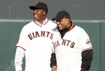 SAN FRANCISCO - AUGUST 9: Barry Bonds shares a laugh with Willie Mays during a San Francisco Giants 50th Anniversary celebration before the game between the Los Angeles Dodgers and San Francisco Giants at AT&T Park on August 9, 2008 in San Francisco, California. (Photo by Max Morse/Getty Images)