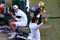 WIMBLEDON, ENGLAND - JULY 05:  Andy Roddick of USA looks despondent as Roger Federer of Switzerland celebrates with the trophy during the men's singles final match on Day Thirteen of the Wimbledon Lawn Tennis Championships at the All England Lawn Tennis and Croquet Club on July 5, 2009 in London, England. Federer won 5-7, 7-6, 7-6, 3-6, 16-14.  (Photo by Julian Finney/Getty Images)