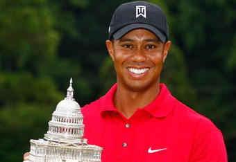 BETHESDA, MD - JULY 05:  Tiger Woods poses with the trophy after his one-stroke victory at the AT&T National at the Congressional Country Club on July 5, 2009 in Bethesda, Maryland.  (Photo by Scott Halleran/Getty Images)
