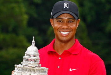 BETHESDA, MD - JULY 05:  Tiger Woods poses with the trophy after his one-stroke victory at the AT&T National at the Congressional Country Club on July 5, 2009 in Bethesda, Maryland.  (Photo by Scott Halleran/Getty Images)
