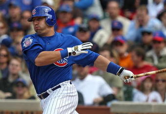 CHICAGO - MAY 27: Jake Fox #5 of the Chicago Cubs hits the ball against the Pittsburgh Pirates on May 27, 2009 at Wrigley Field in Chicago, Illinois. The Cubs defeated the Pirates 5-2. (Photo by Jonathan Daniel/Getty Images)