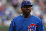 CHICAGO - MAY 27: Milton Bradlery #21 of the Chicago Cubs warms-up before a game against the Pittsburgh Pirates on May 27, 2009 at Wrigley Field in Chicago, Illinois. The Cubs defeated the Pirates 5-2.  (Photo by Jonathan Daniel/Getty Images)