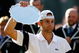 WIMBLEDON, ENGLAND - JULY 05:  Andy Roddick of USA looks despondent after defeat during the men's singles final match against Roger Federer of Switzerland on Day Thirteen of the Wimbledon Lawn Tennis Championships at the All England Lawn Tennis and Croquet Club on July 5, 2009 in London, England. Federer won 5-7, 7-6, 7-6, 3-6, 16-14.  (Photo by Paul Gilham/Getty Images)