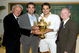 WIMBLEDON, ENGLAND - JULY 05: Roger Federer of Switzerland (2R) celebrates with the trophy alongside Bjorn Borg (L), Pete Sampras (2L) and Rod Laver (R) after the men's singles final match against Andy Roddick of USA on Day Thirteen of the Wimbledon Lawn Tennis Championships at the All England Lawn Tennis and Croquet Club on July 5, 2009 in London, England. Federer won 5-7, 7-6, 7-6, 3-6, 16-14, to claim his 15th Grand Slam title. (Photo by AELTC/Pool/Getty Images)