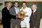WIMBLEDON, ENGLAND - JULY 05:  Roger Federer of Switzerland (2R) celebrates with the trophy alongside Bjorn Borg (L), Pete Sampras (2L) and Rod Laver (R)  after the men's singles final match against Andy Roddick of USA on Day Thirteen of the Wimbledon Lawn Tennis Championships at the All England Lawn Tennis and Croquet Club on July 5, 2009 in London, England. Federer won 5-7, 7-6, 7-6, 3-6, 16-14, to claim his 15th Grand Slam title.  (Photo by AELTC/Pool/Getty Images)