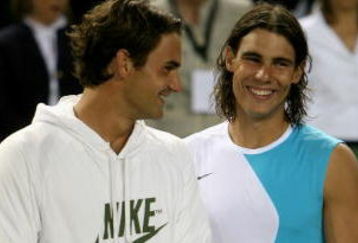MALLORCA, SPAIN - MAY 2: Rafael Nadal of Spain and  Roger Federer of Switzerland share a joke after  the The Battle of the Surfaces between Rafael Nadal and Roger Federer at The Palma Arena on May 2, 2007 in Mallorca, Spain. (Photo by Clive Brunskill/Getty Images)