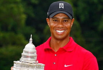 BETHESDA, MD - JULY 05:  Tiger Woods poses with the trophy after his one-stroke victory at the AT&T National at the Congressional Country Club on July 5, 2009 in Bethesda, Maryland.  (Photo by Scott Halleran/Getty Images)