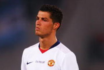 ROME - MAY 27:  Carlos Tevez of Manchester United and Cristiano Ronaldo of Manchester United look dejected after Barcelona won the UEFA Champions League Final match between Barcelona and Manchester United at the Stadio Olimpico on May 27, 2009 in Rome, Italy. Barcelona won 2-0.  (Photo by Laurence Griffiths/Getty Images)