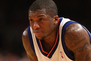 NEW YORK - MARCH 07:  Nate Robinson #4 of the New York Knicks looks on against the Charlotte Bobcats on March 7, 2009 at Madison Square Garden in New York City. NOTE TO USER: User expressly acknowledges and agrees that, by downloading and or using this photograph, User is consenting to the terms and conditions of the Getty Images License Agreement.  (Photo by Nick Laham/Getty Images)