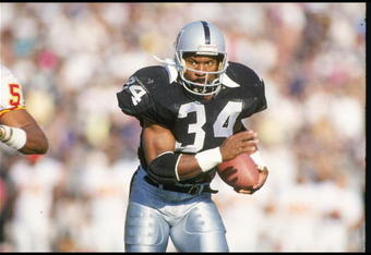 25 Nov 1990: Running back Bo Jackson of the Los Angeles Raiders moves the ball during a game against the Kansas City Chiefs at the Los Angeles Memorial Coliseum in Los Angeles, California. The Chiefs won the game, 27-24.