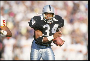 25 Nov 1990: Running back Bo Jackson of the Los Angeles Raiders moves the ball during a game against the Kansas City Chiefs at the Los Angeles Memorial Coliseum in Los Angeles, California. The Chiefs won the game, 27-24.