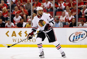 DETROIT - MAY 27:  Dustin Byfuglien #33 of the Chicago Blackhawks skates against the Detroit Red Wings during Game Five of the Western Conference Championship Round of the 2009 Stanley Cup Playoffs on May 27, 2009 at Joe Louis Arena in Detroit, Michigan. The Red Wings won 2-1 in overtime.  (Photo by Gregory Shamus/Getty Images)