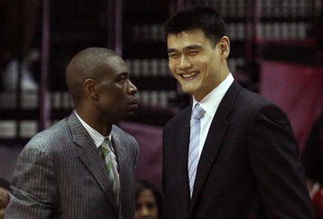HOUSTON - MAY 10:  Center Dikembe Mutombo and Yao Ming of the Houston Rockets during Game Four of the Western Conference Semifinals during the 2009 NBA Playoffs at Toyota Center on May 10, 2009 in Houston, Texas. NOTE TO USER: User expressly acknowledges and agrees that, by downloading and or using this photograph, User is consenting to the terms and conditions of the Getty Images License Agreement.  (Photo by Ronald Martinez/Getty Images)