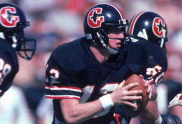 FEBRUARY 1985:  Quarterback Jim Kelly #12 of the Houston Gamblers scrambles during a 1985 season USFL game. (Photo by Stephen Dunn/Getty Images)