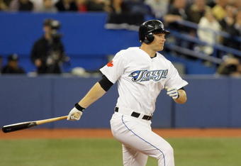 TORONTO - APRIL 6:  Adam Lind #26 of the Toronto Blue Jays swings at the pitch during the Opening Day game against the Detroit Tigers at the Rogers Centre on April 6, 2009 in Toronto, Ontario. (Photo by: Dave Sandford/Getty Images)