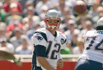 FOXBORO, MA - SEPTEMBER 7:  Quarterback Tom Brady #12 of the New England Patriots passes the ball up the middle during their NFL game against the Kansas City Chiefs on September 7, 2008 at Gillette Stadium in Foxboro, Massachusetts. The Patriots defeated the Chiefs 17-10. (Photo by Elsa Garrison/Getty Images)