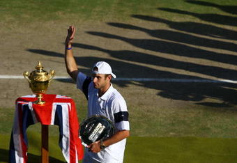 WIMBLEDON, ENGLAND - JULY 05:  Andy Roddick of USA waves to the crowd after defeat during the men's singles final match against Roger Federer of Switzerland on Day Thirteen of the Wimbledon Lawn Tennis Championships at the All England Lawn Tennis and Croquet Club on July 5, 2009 in London, England. Federer won 5-7, 7-6, 7-6, 3-6, 16-14.  (Photo by Julian Finney/Getty Images)