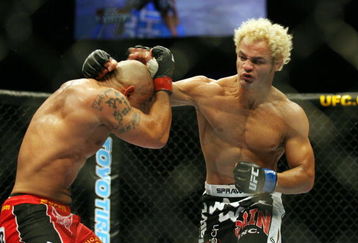 CHICAGO- OCTOBER 25: Josh Koscheck (R) punches Thiago Alves in a Welterweight bout  at UFC's Ultimate Fight Night at Allstate Arena on October 25, 2008 in Chicago, Illinois. (Photo by Tasos Katopodis/Getty Images)