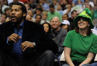 DALLAS - MARCH 17:  NBA fan, Amy Hill of Disney, Oklahoma watches a game while sitting next to Rasheed Wallace of the Detroit Pistons during play against the Dallas Mavericks on March 17, 2009 at American Airlines Center in Dallas, Texas.  NOTE TO USER: User expressly acknowledges and agrees that, by downloading and/or using this Photograph, user is consenting to the terms and conditions of the Getty Images License Agreement.  (Photo by Ronald Martinez/Getty Images)