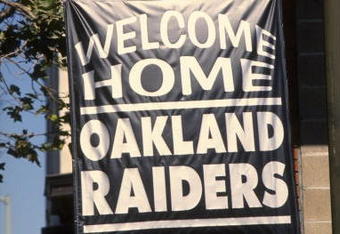 12 Aug 1995:  A local real estate business shows their support for the Raiders return to Oakland by hanging a banner outside the office during the Raiders 27-22 victory over the St. Louis Rams at the Oakland Alameda County Coliseum in Oakland, California.