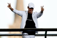 WIMBLEDON, ENGLAND - JULY 05: Roger Federer of Switzerland salutes spectators after victory in the men's singles final match against Andy Roddick of USA on Day Thirteen of the Wimbledon Lawn Tennis Championships at the All England Lawn Tennis and Croquet Club on July 5, 2009 in London, England. Federer won 5-7, 7-6, 7-6, 3-6, 16-14, to claim his 15th Grand Slam title. (Photo by Paul Gilham/Getty Images)