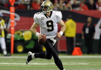 ATLANTA - NOVEMBER 9: Quarterback Drew Brees #9 of the New Orleans Saints sets to pass against the Atlanta Falcons at the Georgia Dome on November 9, 2008 in Atlanta, Georgia.  (Photo by Al Messerschmidt/Getty Images) 