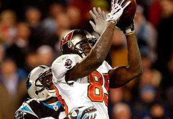 CHARLOTTE, NC - DECEMBER 08:  Antonio Bryant #89 of the Tampa Bay Buccaneers catches a pass over Chris Gamble #20 of the Carolina Panthers at Bank of America Stadium on December 8, 2008 in Charlotte, North Carolina.  (Photo by Streeter Lecka/Getty Images)