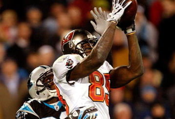 CHARLOTTE, NC - DECEMBER 08:  Antonio Bryant #89 of the Tampa Bay Buccaneers catches a pass over Chris Gamble #20 of the Carolina Panthers at Bank of America Stadium on December 8, 2008 in Charlotte, North Carolina.  (Photo by Streeter Lecka/Getty Images)