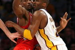 LOS ANGELES, CA - MAY 17:  Kobe Bryant #24 of the Los Angeles Lakers is covered by Ron Artest #96 of the Houston Rockets in the third quarter of Game Seven of the Western Conference Semifinals during the 2009 NBA Playoffs at Staples Center on May 17, 2009 in Los Angeles, California. NOTE TO USER: User expressly acknowledges and agrees that, by downloading and or using this photograph, User is consenting to the terms and conditions of the Getty Images License Agreement.  (Photo by Stephen Dunn/Getty Images)