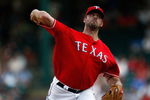 ARLINGTON, TX - JULY 1:  Pitcher Kevin Millwood #33 of the Texas Rangers throws against the Los Angeles Angels of Anaheim at Rangers Ballpark July 1, 2009 in Arlington, Texas.  (Photo by Ronald Martinez/Getty Images)