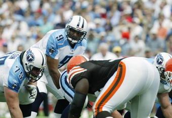 NASHVILLE, TN - SEPTEMBER 22:  Quarterback Steve McNair #9 of the Tennessee Titans crouches over center Gennaro DiNapoli #64 during the NFL game against the Cleveland Browns on September 22, 2002 at The Coliseum in Nashville, Tennessee.  The Browns won 31-28 in ovetime.  (Photo by Craig Jones/Getty Images)