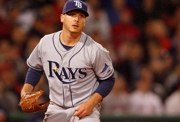 BOSTON - APRIL 8: Scott Kazmir #19 of the Tampa Bay Rays watches the flight of a hit ball against the Boston Red Sox at Fenway Park, April 8, 2009, in Boston, Massachusetts. (Photo by Jim Rogash/Getty Images)